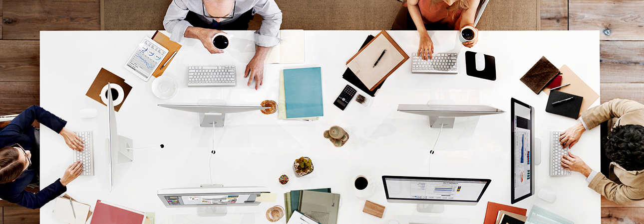 top down view of workers at a table