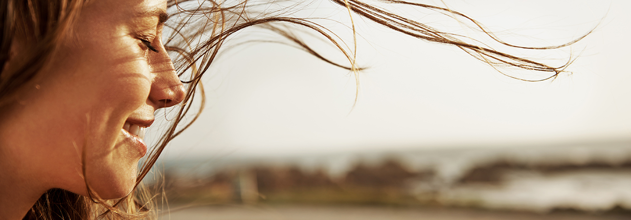 woman with hair blowing in wind