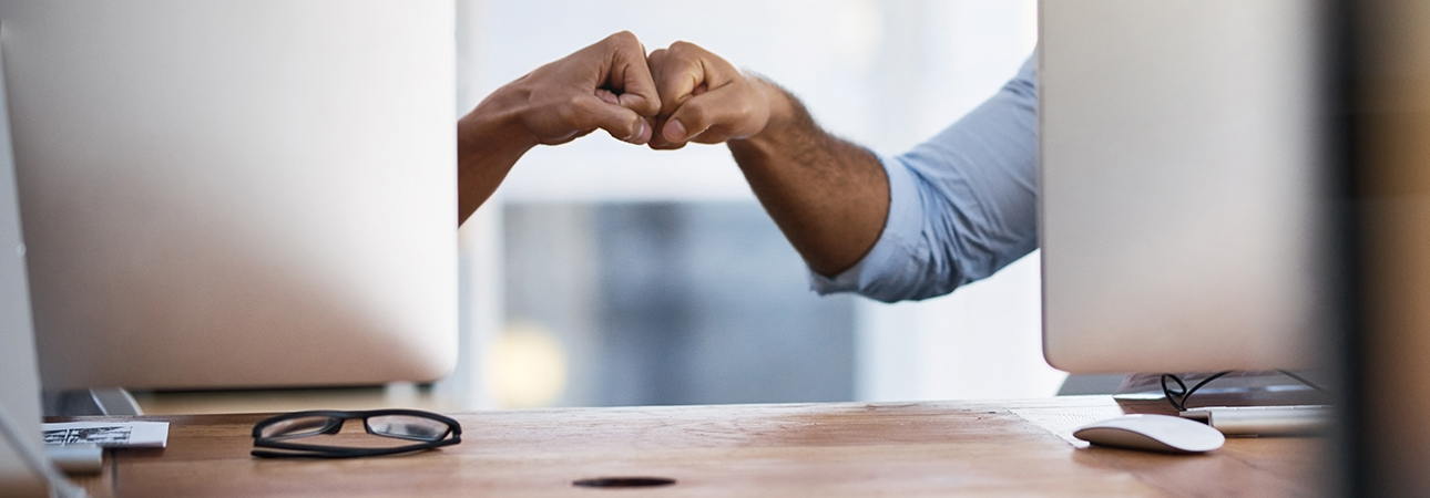 coworkers fist bumping