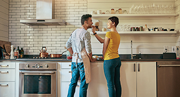 Couple cooking in kitchen